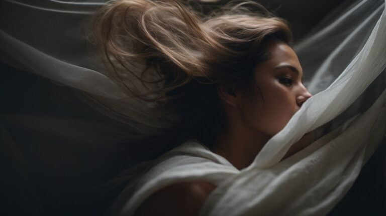Young woman sleeping peacefully in bed, recovering from substance addiction, emphasizing the importance of drug detox and rehab for mental health and sobriety.